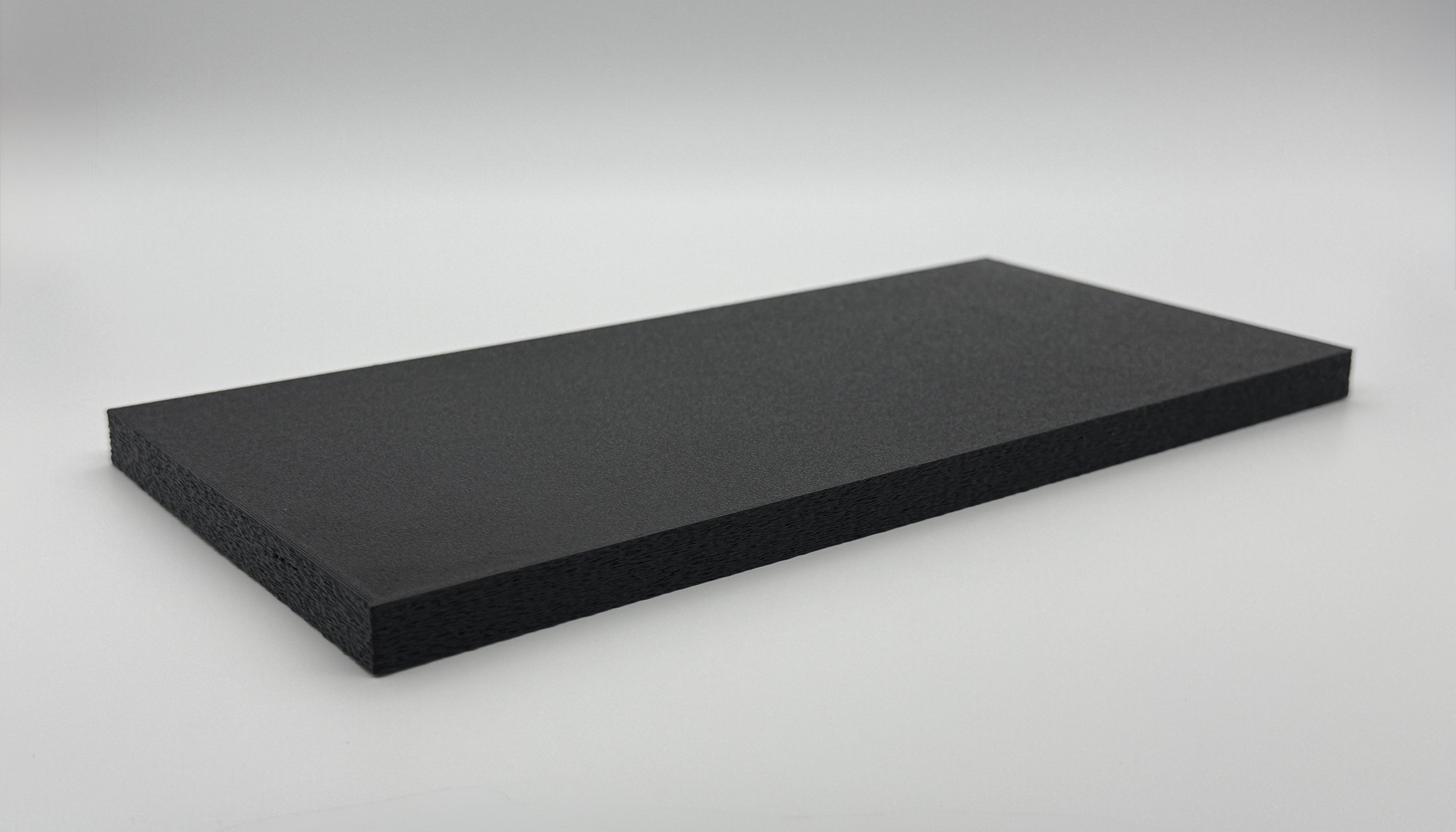 Black 3D-printed protective lid for the SlabGrid Mini Double 2x2 coin holder display