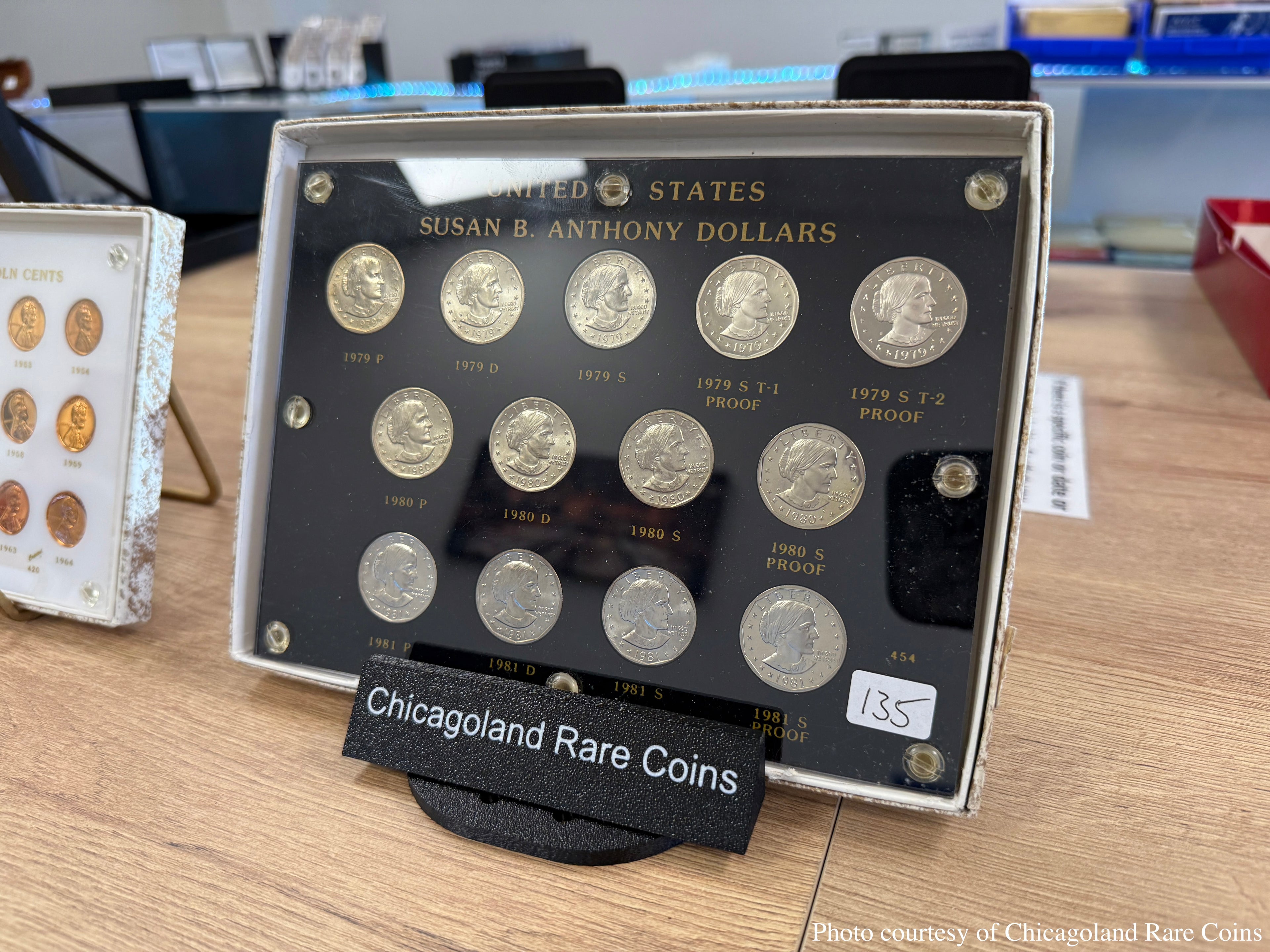 Black 3D-printed SlabGrid FlexStand adjustable display stand for a graded coin slab