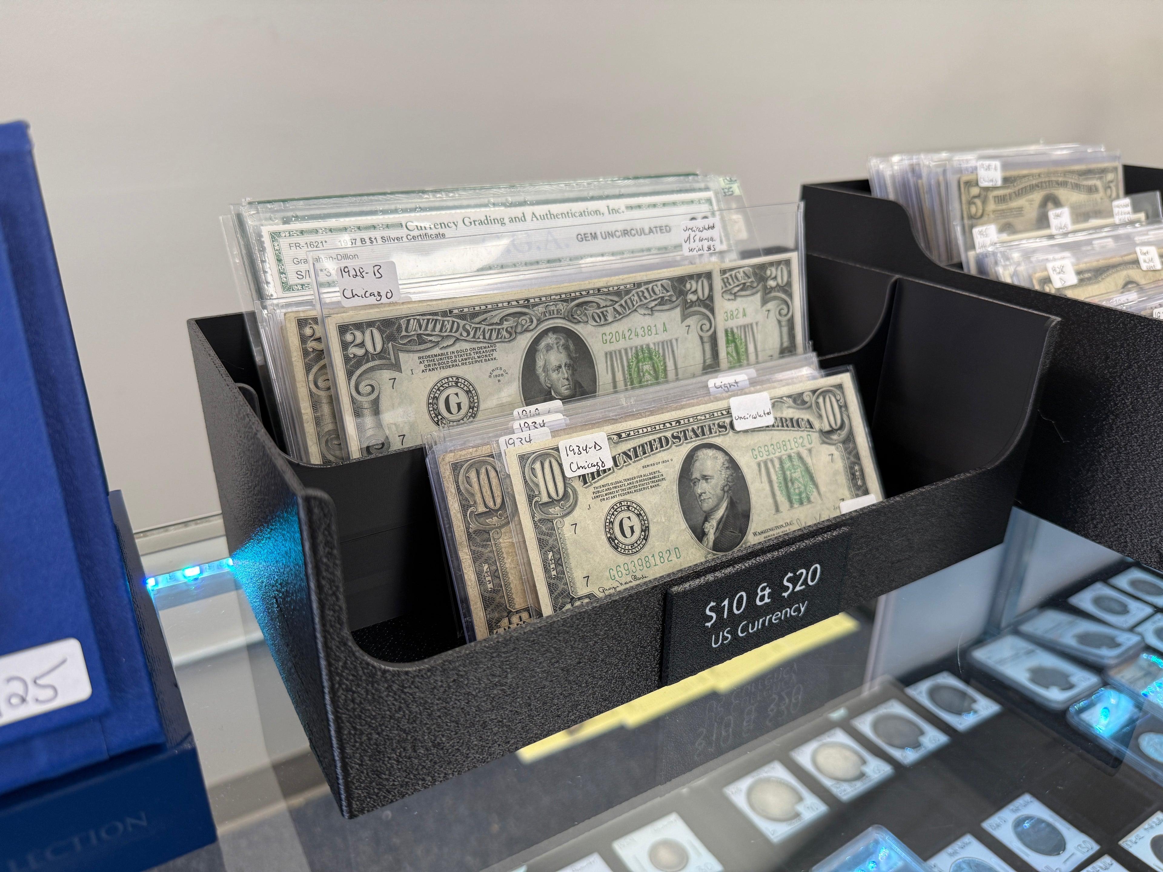 Angled view of the CurrencyStadium deep tray with graded currency notes displayed
