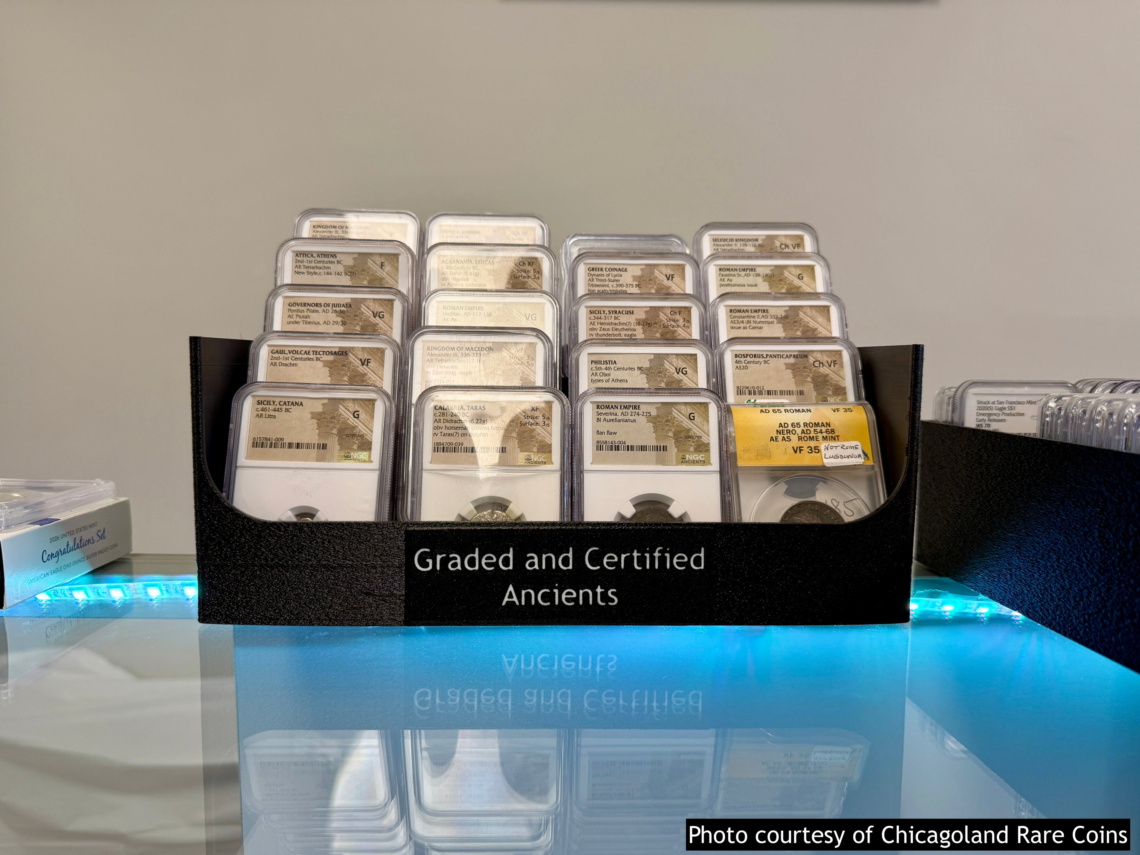 Black 3D-printed SlabStadium tiered display stand for 20 graded coin slabs